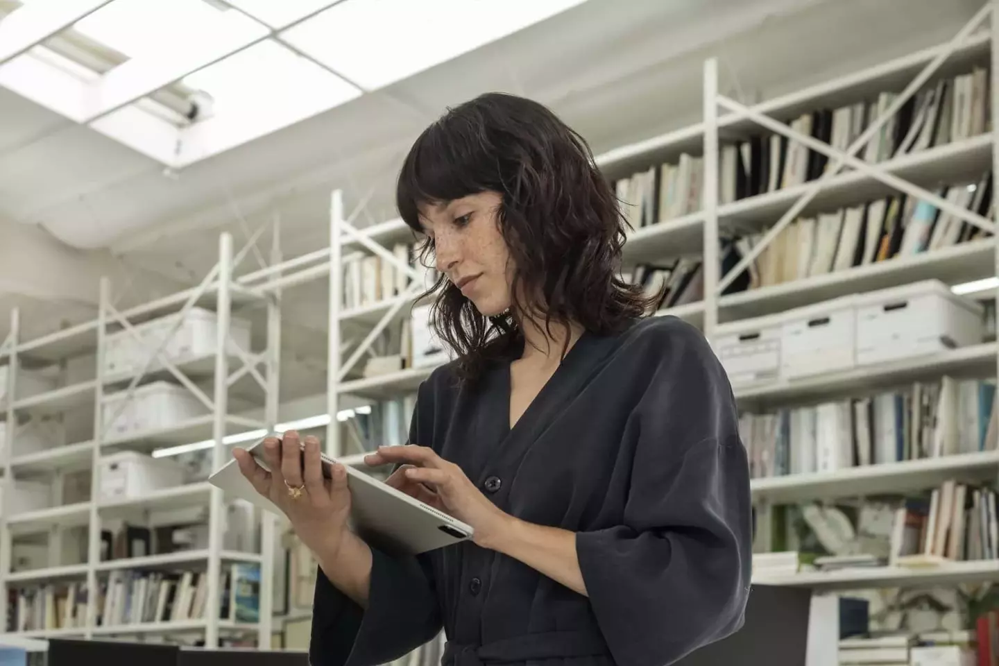 Lady tapping on a tablet